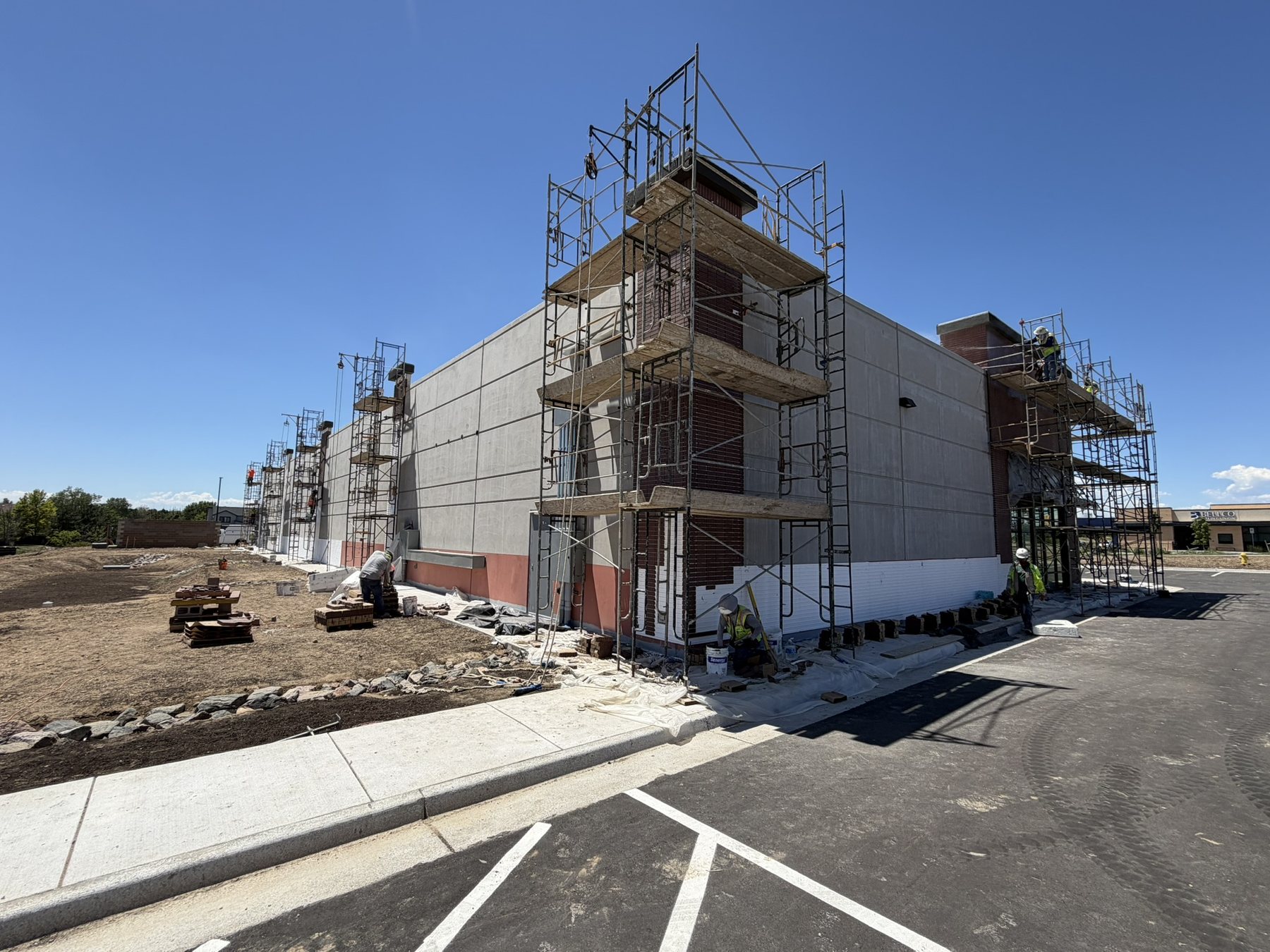 Masonry and stucco underway on the rear elevation
